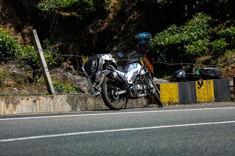 A touring motorbike parked on a hill road