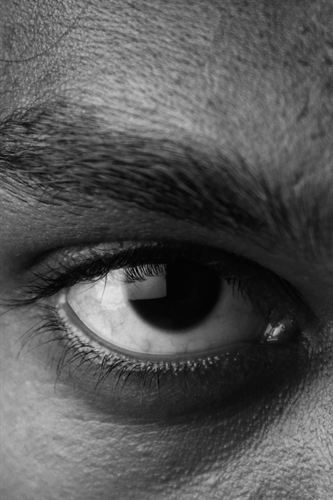 A close-up of an eye in black and white