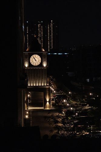 A clock tower lit up at night